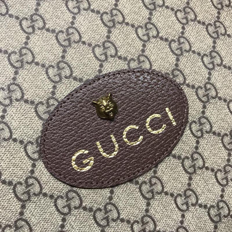 G*u*i clutch bag