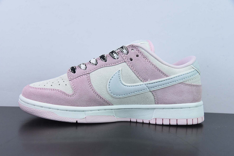 the nike dunk low appears in pink and grey suede dv3054-600